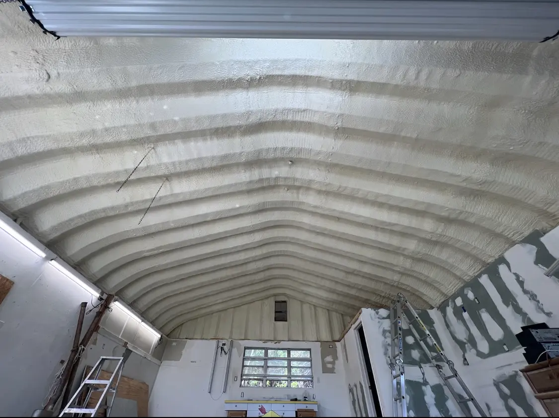 Spray polyurethane foam applied to the underside of a metal roof deck in Fairburn