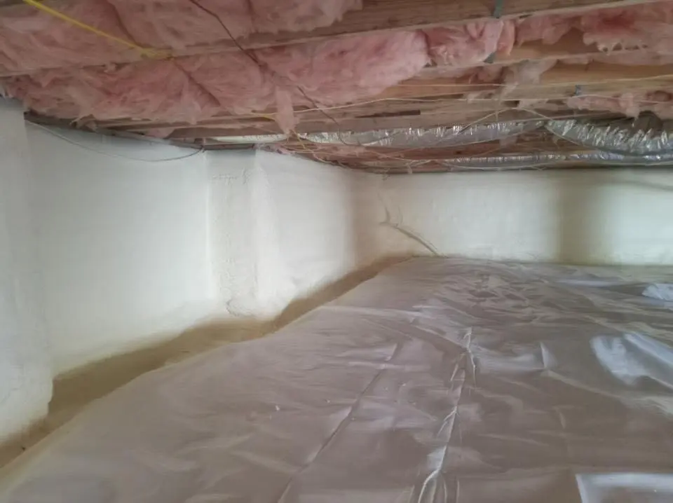 Crawl space encapsulation with closed-cell spray foam for Commercial Roof Restoration in Fairburn
